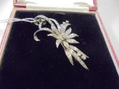 A superb quality 18ct white gold and diamond set brooch as a flower spray. (11.8gms)