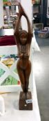 A tall wooden sculpture of a nude woman (height 59.5cm)