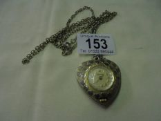 A vintage Lucerne Swiss made pendant watch on chain, in working order.