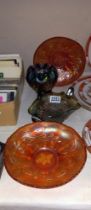 Four pieces of carnival glass including marigold.