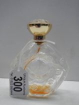 A Lalique glass perfume bottle.