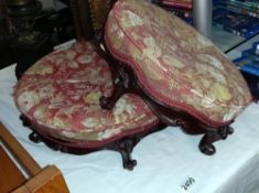 A pair of ornate Victorian style foot stools