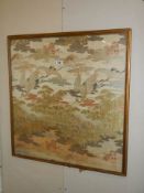 A framed Chinese silk depicting birds. COLLECT ONLY.