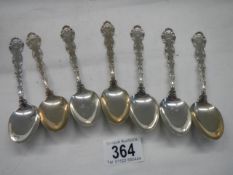 Seven sterling silver tea spoons.