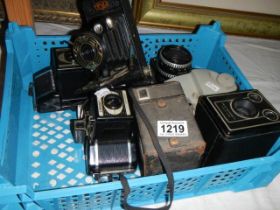 A box of vintage camera's.