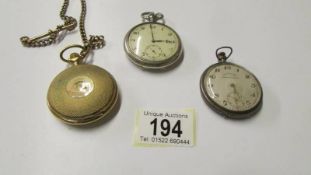 A silver (800) pocket watch and two others.