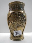 A Chinese Bronze vase decorated with relief birds.