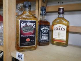 A bottle of Jack Daniels and two others.