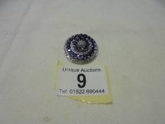 An 18ct white gold diamond and sapphire pendant, 14.5 grams.