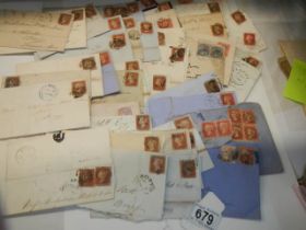 Approximately 47 penny red stamps on postmarked envelopes.