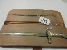 A cased letter opener in the form of a dagger with eagle feature.