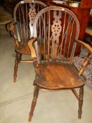 A pair of wheel back Windsor chairs, COLLECT ONLY.