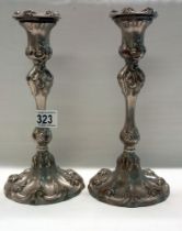A pair of art nouveau style silver plate candlesticks.