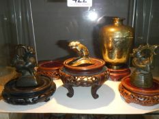 A collection of early bronze and brass Chinese figures etc.,