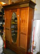 An Edwardian mahogany inlaid drawer base wardrobe with mirrored doors, COLLECT ONLY.
