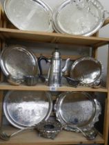 Three shelves of good silver plate including trays, ladles, coffee pot, sauce boats etc.,