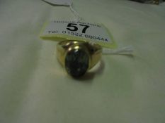 A gold ring set green stone (hallmark rubbed), size L half, 6 grams.