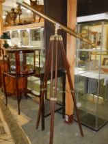 A 100cm brass telescope on brass bound mahogany tripod stand.