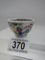 An 18th century Chinese ceramic wine cup.