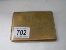 A 19th century Welsh miners brass cigarette case stamped MAT EVANS 1804 (number 0 has over stamped