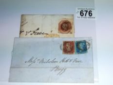 A penny red, a twopenny blue and one other postage stamp on postmarked envelopes.