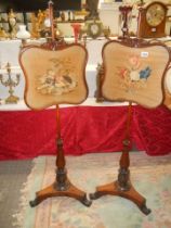 A pair of Victorian rosewood pole screens, COLLECT ONLY.