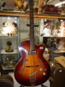 A Hofner Senator Brun E1 thin 1950's electro/acoustic guitar, original pick guard, brown hard case.