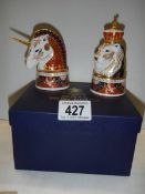 A boxed pair of Royal Worcester candlesnuffers - The Lion and The Unicorn.