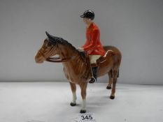 A Beswick horse with red jacket huntsman, 22 cm