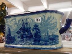 A 20th century porcelain blue and white foot bath featuring ships on inside and out. COLLECT ONLY.