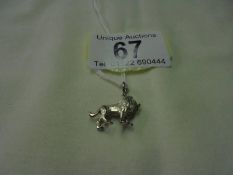 A silver lion pendant/charm.