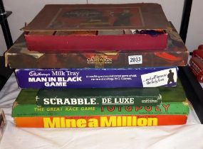 A quantity of games including Scrabble (letters still wrapped in original packaging), Totopoly,