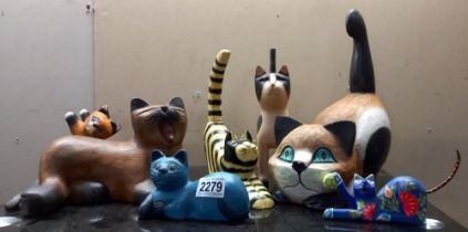 A quantity of wooden cats