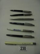 Seven Parker advertising pens.