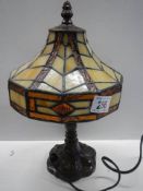 A table lamp with Tiffany style shade, 31 cm tall.