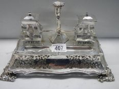 A 19th century silver plate ink stand with glass inkwell, dated 1860.