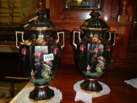 A pair of early 20th century hand painted vases.