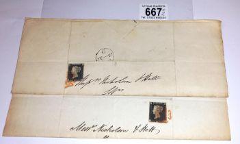 Two mid 19th century penny black postage stamps on postmarked envelopes.