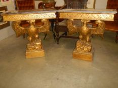 A pair of marble top console tables supported by eagles. COLLECT ONLY