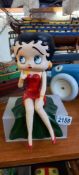 A Betty Boop cast iron singing figure in a sitting position to display on a shelf