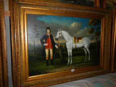 A gilt framed oil on canvas painting of a horse with rider, frame 114 x 84 cm, image 90 x 80 cm,