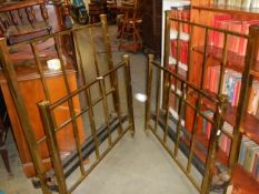 A pair of three foot brass bedsteads complete with side rails. COLLECT ONLY.