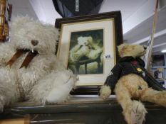 Two collector's bears together with a framed photo on one of them,