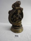 Ornate heavy bronze of Hindu god Ganesha seated in a conch shell set on a lotus base. H 21cm x W10cm