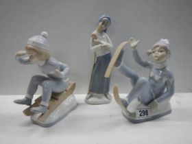 Three Lladro style figures.