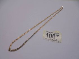 A tri-coloured 9ct gold necklace, 3.6 grams.