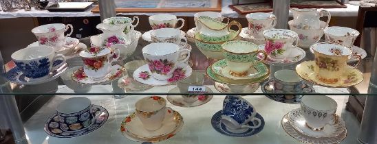 A good selection of china cups and saucers plus trios, including Royal Albert etc