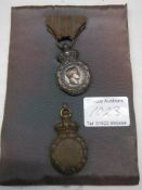 Two Napoleonic medals.
