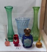 A quantity of coloured glass vases etc plus a small oil/paraffin lamp