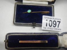 Two 9ct gold brooches on being set an opal, 3.55 grams.